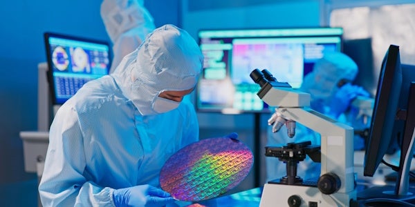 Person handling a silicon wafer